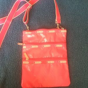 Lesportsac neon pink vinyl crossbody